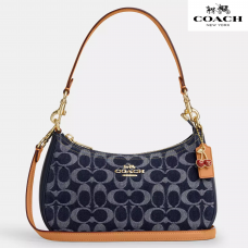 Сумка через плечо Coach Teri из фирменной  синей джинсы с натуральной кожей и золотой отделкой