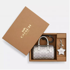 Мини-сумка через плечо Coach Rowan с подвеской и зеркальцем в фирменном канвас, серебряная