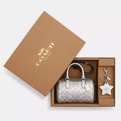 Мини-сумка через плечо Coach Rowan с подвеской и зеркальцем в фирменном канвас,серебряная